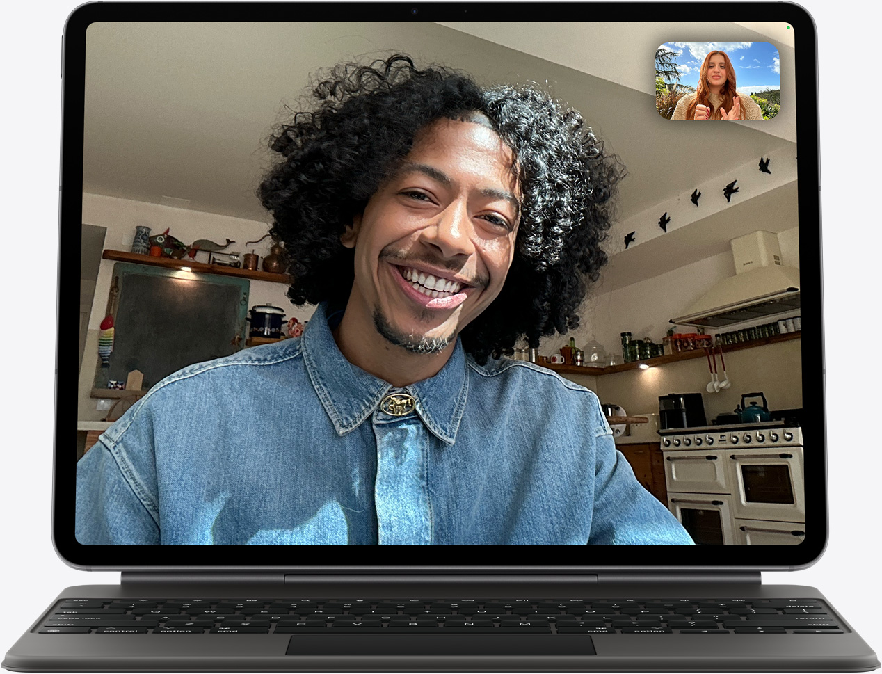 iPad Air, front exterior, Magic Keyboard, black color, FaceTime call on the screen, multiple participants visible