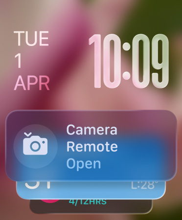 Remote Camera widget appears at bottom of screen, translucent time numerals at top right, date at top left