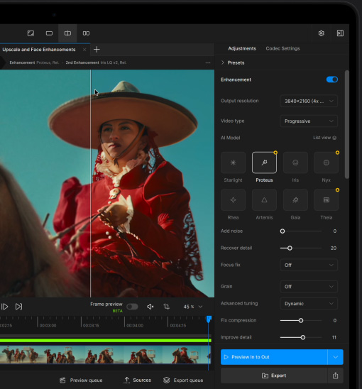 A MacBook Pro screen showing a video getting enhanced with AI in Topaz Video